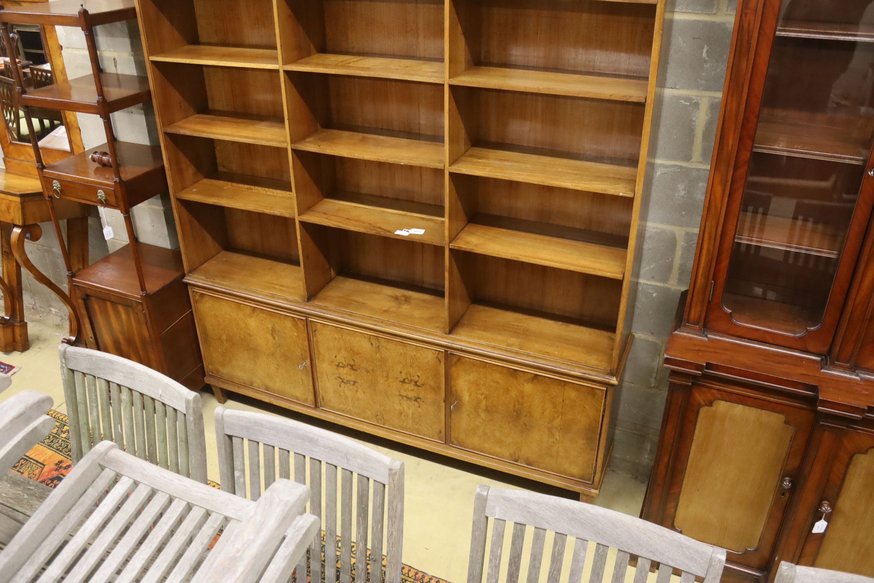 A mid century walnut open bookcase cupboard, length 186cm, depth 30cm, height 220cm